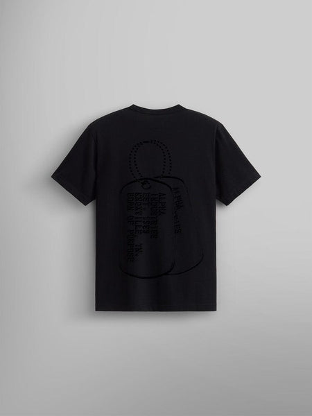 Alpha Dog Tag Tee by Alpha Industries is a black t-shirt showcasing a bold, dark dog tag screen print graphic and text on the back.