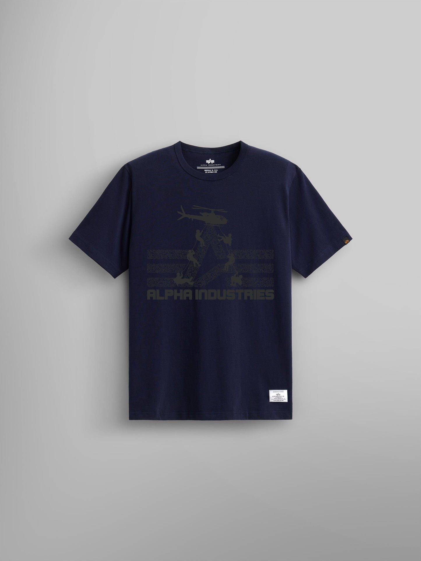 A Replica Blue T-shirt, perfect for air assault enthusiasts, showcases a subtle helicopter graphic and prominently displays the iconic Alpha Industries text on the front. It's part of the ALPHA AIR ASSAULT REPEL TEE collection by Alpha Industries from FW24-DROP1.