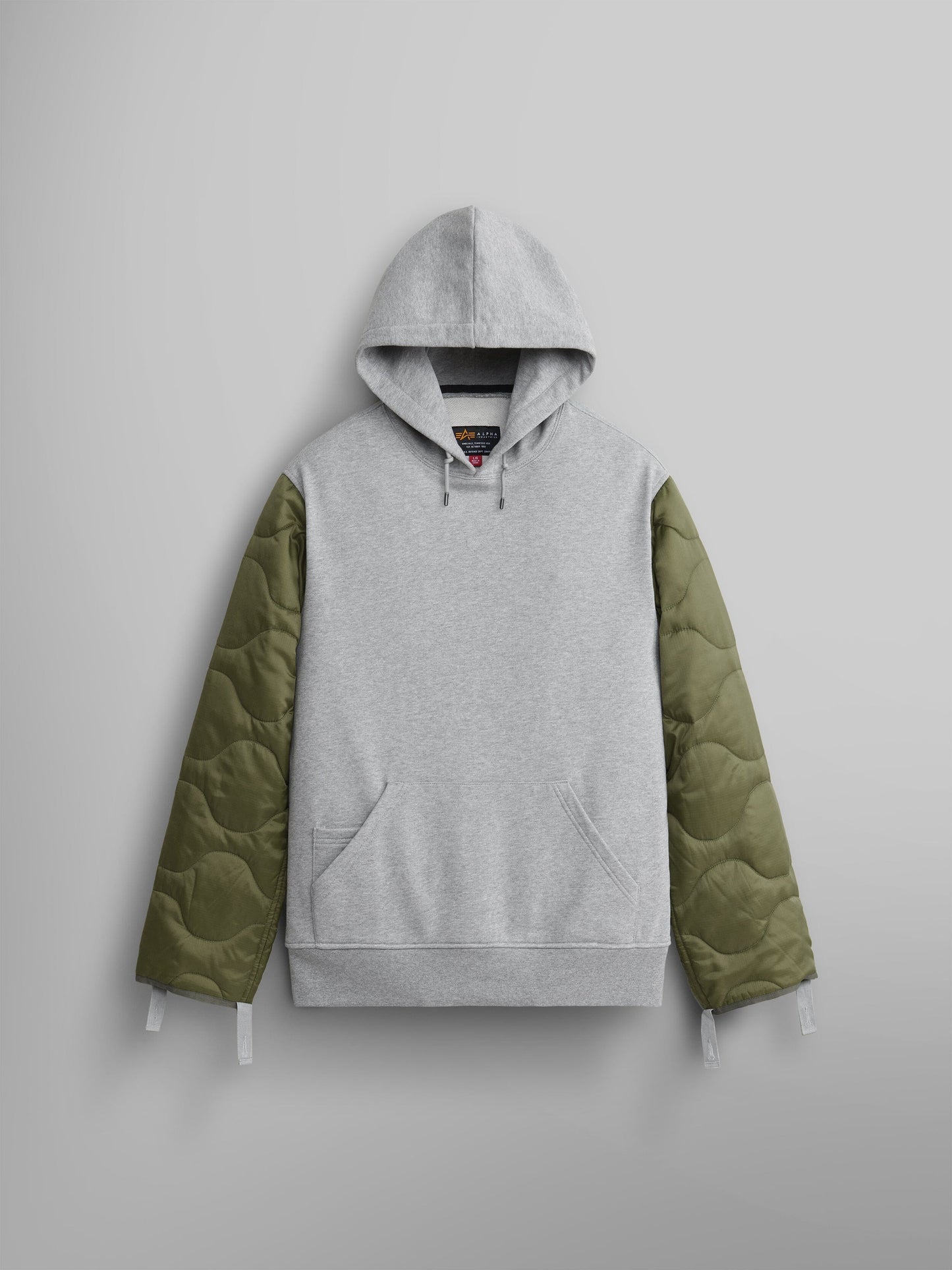 Unisex-Style ALS/92 Quilted Liner Hoodie by Alpha Industries, showcasing medium charcoal heather fabric and sleeves with green onion quilting.