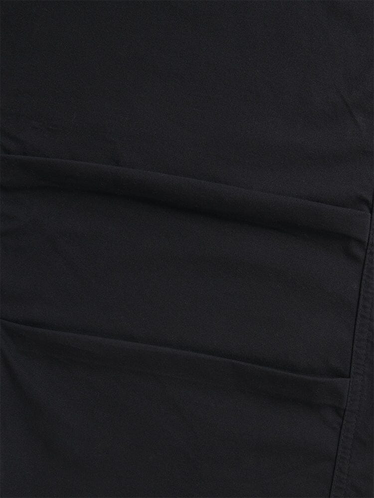 A close-up of the Women's Barrel Leg Pants in black by Alpha Industries highlights the fabric's seams and stitching, radiating the detailed craftsmanship reminiscent of high-waisted pants.