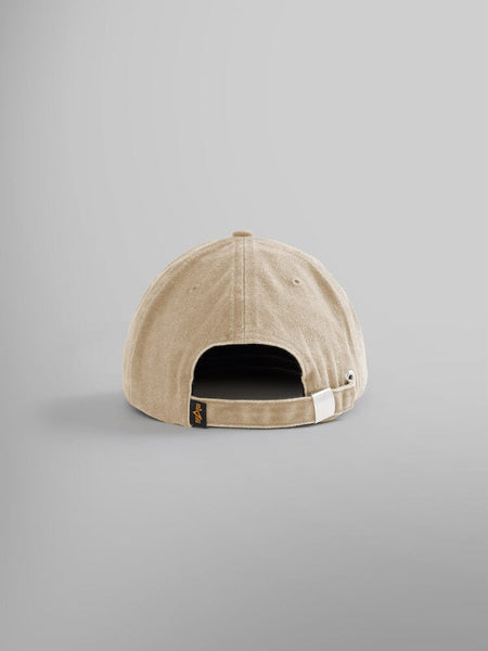 From the rear, the Battlewash Cap by Alpha Industries howcases vintage-inspired style in khaki, complete with an adjustable strap and a subtle black tag.