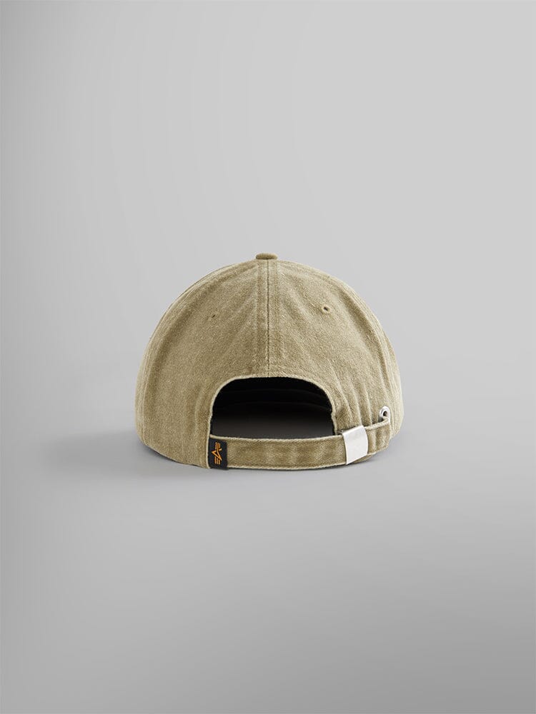 The Battlewash Cap by Alpha Industries, is a vintage-inspired olive baseball cap shown from the back. It features an adjustable strap and a small black tag, with its battlewash finish.