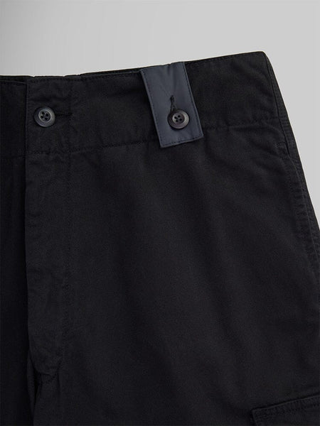 Close-up of the Belgian M-64 Pant by Alpha Industries, featuring a buttoned waistband detail.