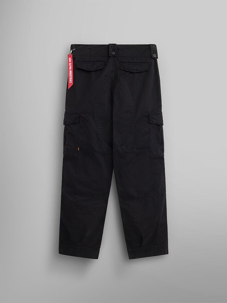 Back view of the Belgian M-64 Pant by Alpha Industries features black cargo pants with multiple pockets and a distinctive red tag on the side.