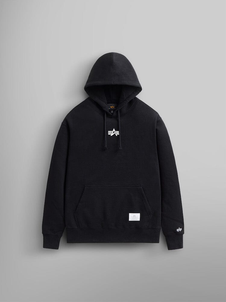 The Born Of Purpose Hoodie by Alpha Industries. This black hoodie showcases a subtle white logo on the chest and is crafted from heavy cotton. It features a handy kangaroo pocket and cuffed sleeves.