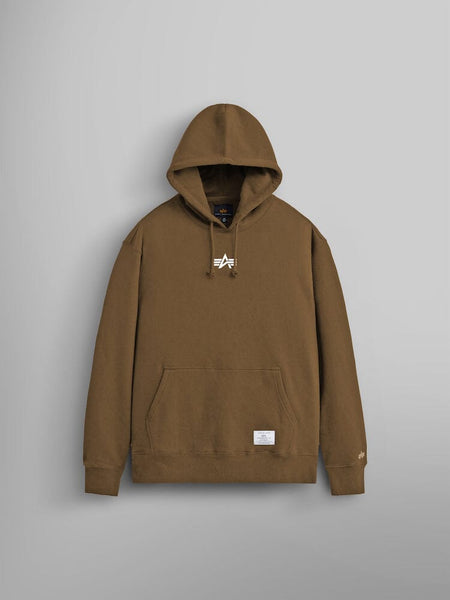 The Born Of Purpose Hoodie by Alpha Industries showcases a unisex design in coyote brown. Made from heavy cotton, it features a front kangaroo pocket and small embroidered details.