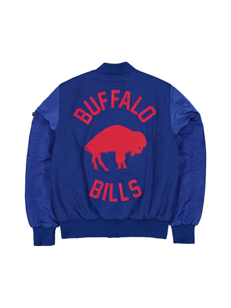 Introducing the Buffalo Bills x Alpha x New Era MA-1 Bomber Jacket from Alpha Industries. This NFL bomber jacket proudly showcases a blue design, featuring the Buffalo Bills logo and a bold red buffalo silhouette on the back. Crafted with a wool outer shell and adorned with team patches, it's an essential addition for any dedicated Bills fan.