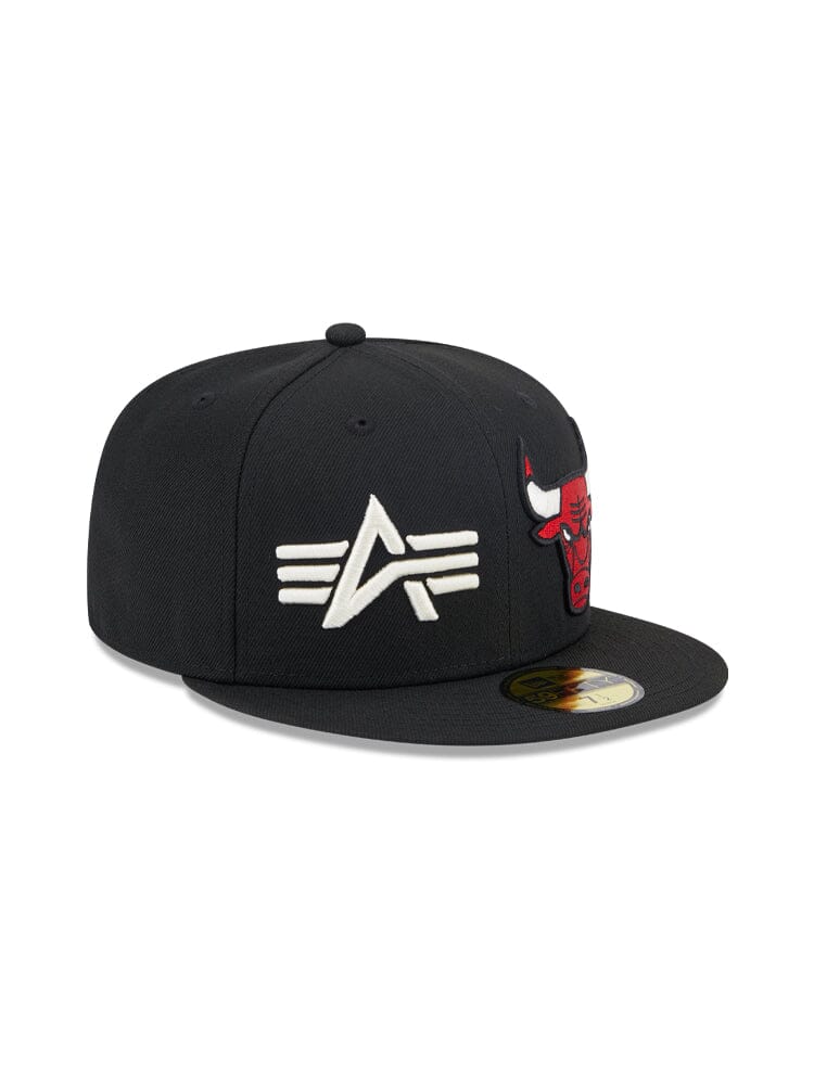 The Chicago Bulls x Alpha Industries x New Era 59Fifty Fitted Cap, in classic team colors, showcases a stylized A with wings and a red bull logo on the front, representing the renowned quality of Alpha Industries® / NE-NBA.