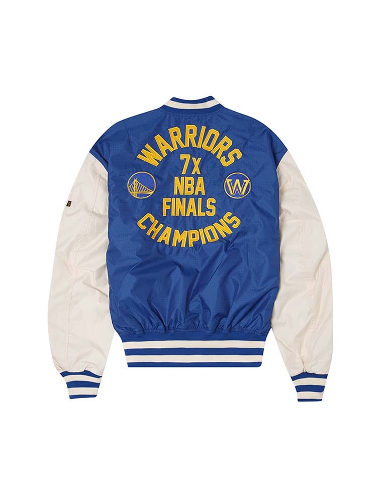 The Golden State Warriors x Alpha Industries x New Era L-2B Bomber Jacket by Alpha Industries showcases a stylish reversible blue and white design, highlighted by the Warriors 7x NBA Finals Champions and logos on the back, along with distinctive team patches for a classic NBA Bomber Jacket aesthetic.