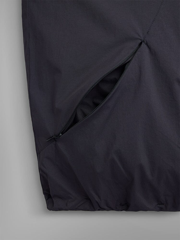 A close-up of the Insulated Hooded Parka by Alpha Industries, showcasing its open side pocket with a concealed zipper, crafted from water-resistant material.