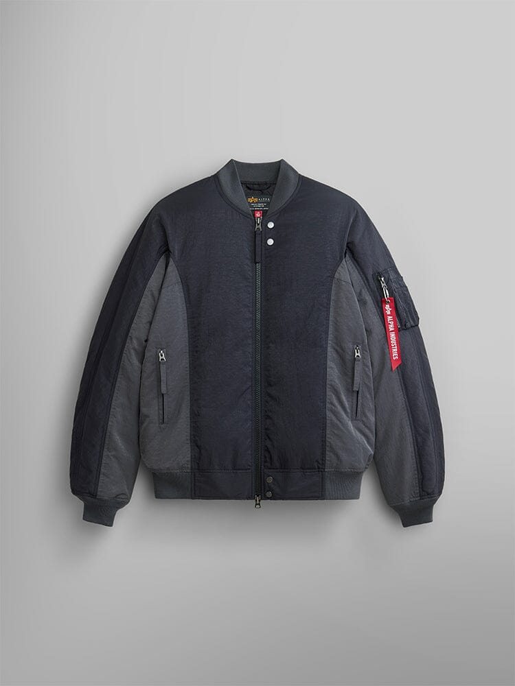 The Insulated MA-1 Bomber Jacket by Alpha Industries is a black jacket with responsible down fill. It features a zipper front, along with side and sleeve pockets, and includes the iconic red Remove Before Flight tag.