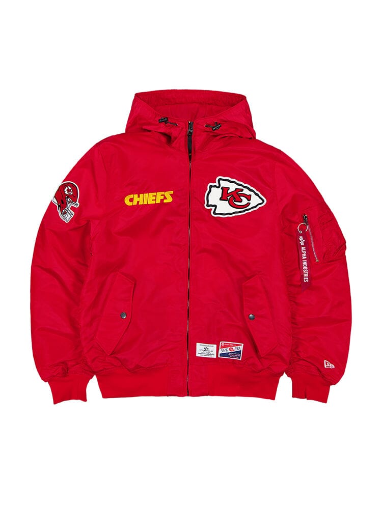 The Kansas City Chiefs X Alpha x New Era L-2B Bomber Jacket, in a striking Speed Red color, features the distinctive Kansas City Chiefs logo and text along with patches on the sleeve and chest.