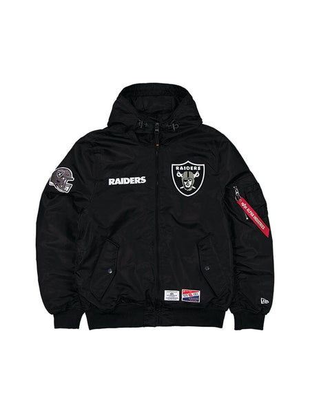 The Las Vegas Raiders x Alpha x New Era L-2B Bomber Jacket, designed by Alpha Industries, features a sleek black color and displays the iconic team logo and "Raiders" text on the front. A logo adorns the sleeve, complemented by a distinctive red tag on the left side. It's an ideal choice for NFL fans looking to stay stylish while proudly supporting their team.