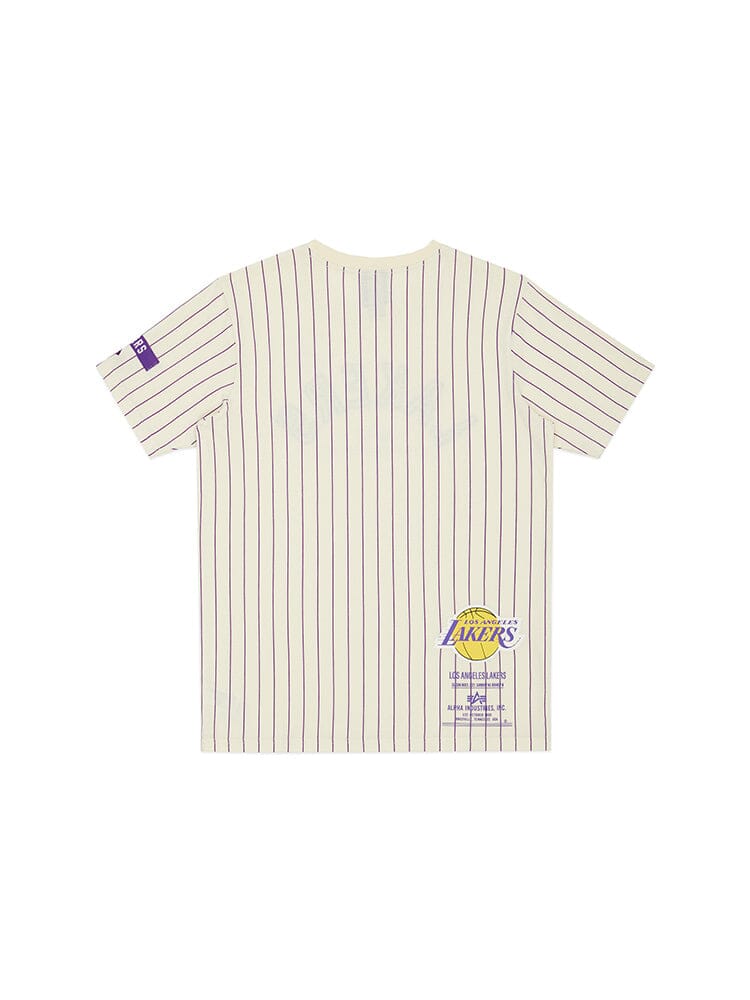 The Los Angeles Lakers x Alpha x New Era Tee, from Alpha Industries and NE-NBA, features a pinstripe cream design with a subtle Los Angeles Lakers logo on the lower back, making it ideal for any NBA enthusiast.