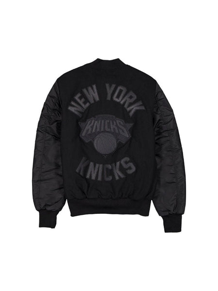 Quilted-sleeve wool varsity MA-1 bomber jacket by Alpha Industries, featuring the New York Knicks and a basketball logo on the back.