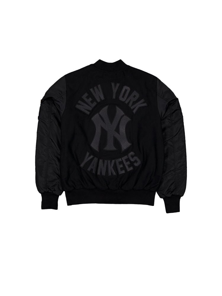 The New York Yankees X Alpha X New Era Wool Varsity MA-1 Bomber Jacket by Alpha Industries, with product code FW24-NE-MLB, showcases a New York Yankees logo and text on the back, complete with classic faux leather sleeves and an MA-1 utility pocket for enhanced style and function.