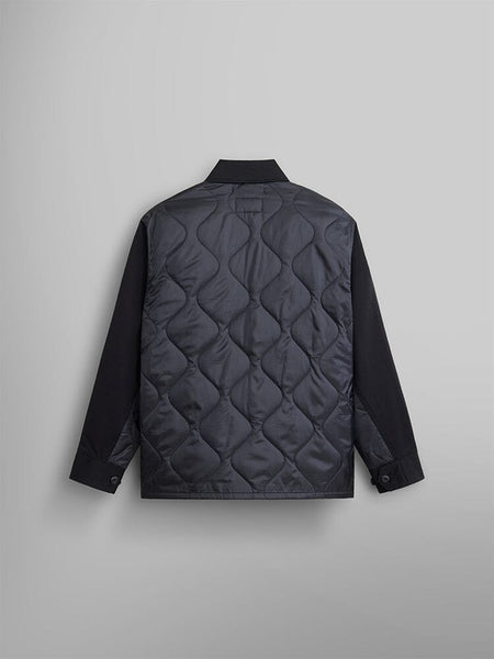 Back view of the Onion Quilted Mixed Media Shirt Jacket by Alpha Industries. It features a black hue with a quilted back panel using onion quilting, complemented by long sleeves and buttoned cuffs.