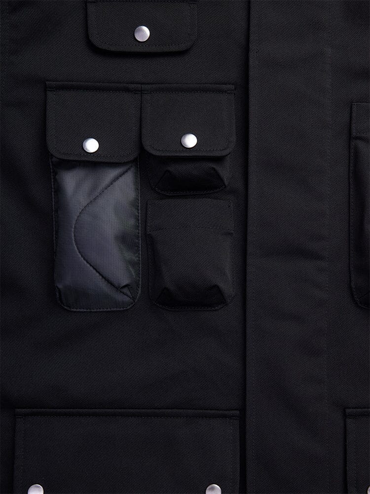 Detailed view of the Onion Quilted Mixed Media Shirt Jacket by Alpha Industries. This black shacket showcases onion quilting, enhanced with multiple pockets and finished with silver button closures.