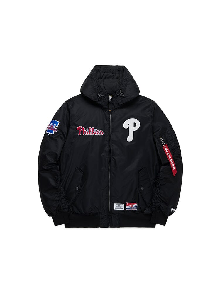 The Philadelphia Phillies X Alpha X New Era L-2B Bomber Jacket in black, by Alpha Industries, boasts patches that include a prominent "P" on the left, Phillies script on the right, and a vivid MLB emblem on the sleeve.