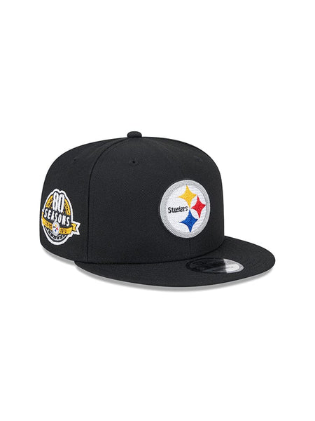 A black Pittsburgh Steelers x Alpha x New Era 950 Cap proudly features the team logo, with an 80 Seasons patch on the side.