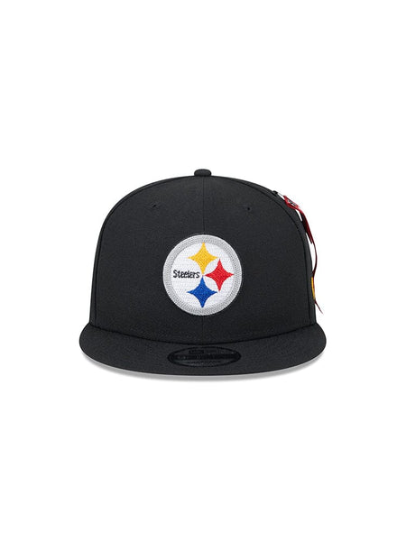 Introducing the Pittsburgh Steelers x Alpha x New Era 950 Cap, a stylish black snapback from Alpha Industries, featuring the classic team logo that seamlessly combines traditional sports style with modern flair.