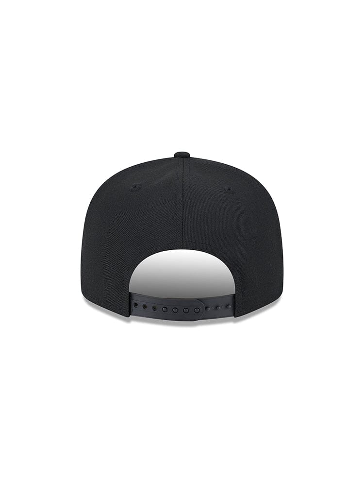 A view from the back of the black Pittsburgh Steelers X Alpha X New Era 950 Cap shows its adjustable strap and ventilation holes, adorned with the iconic Alpha Industries team logo prominently displayed.