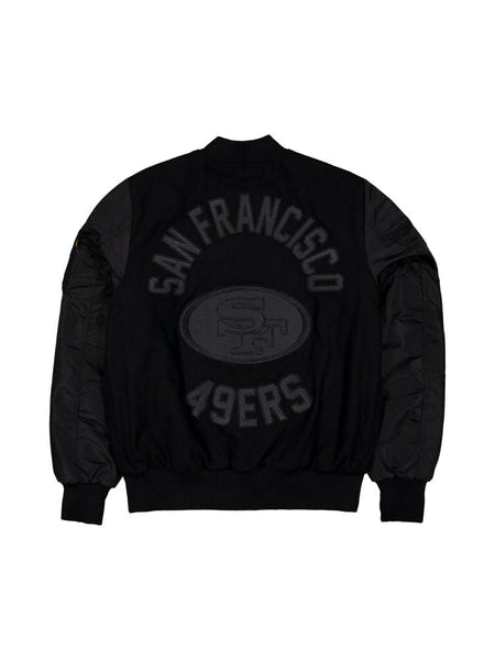 The San Francisco 49ers x Alpha x New Era Wool Varsity MA-1 Bomber Jacket by Alpha Industries features a large logo on the back, designed in black with a wool outer shell for warmth.