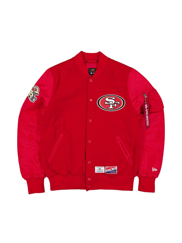 Speed Red San Fransisco 49ers X Alpha X New Era MA-1 Bomber Jacket by Alpha Industries, designed with the team logo on the front and NFL patches on the sleeves, and finished with a cozy quilted lining.