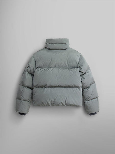 The Sierra Short Puffer W by Alpha Industries is a gray water-resistant jacket viewed from the back. It features a high collar and includes a logo patch on the upper left sleeve.