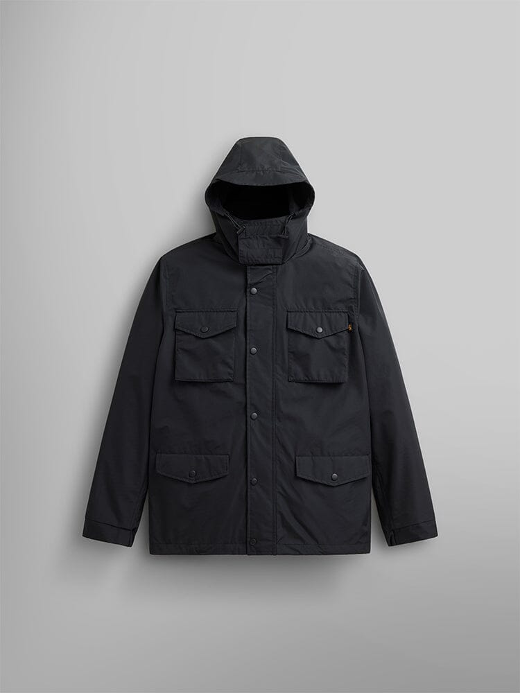 The Tactical M-65 Field Jacket, featuring a black color and designed in the style of a field coat by Alpha Industries, showcases front buttons and four pockets.