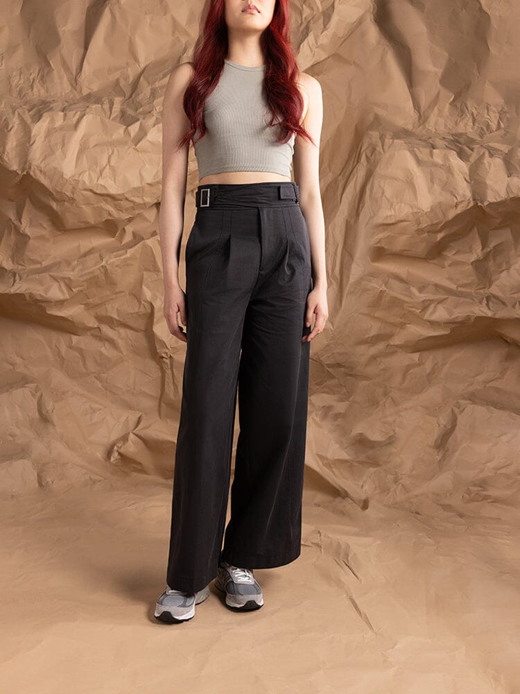 A person wearing the Women's Gurkha Wide Leg Trouser in black by Alpha Industries.