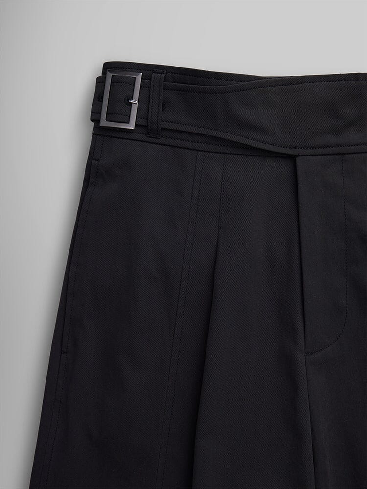 Close-up view of the Women's Gurkha Wide Leg Trouser in black by Alpha Industries, featuring pleats and a black belt with a metal buckle.