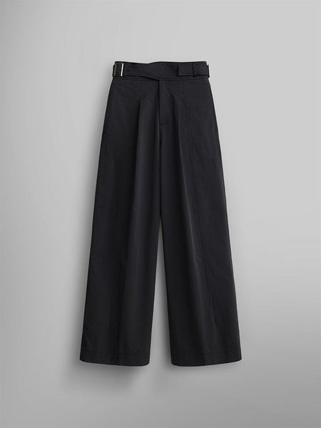 The Women's Gurkha Wide Leg Trouser in black by Alpha Industries features a high-waisted design with a wide-leg silhouette and pleated front.