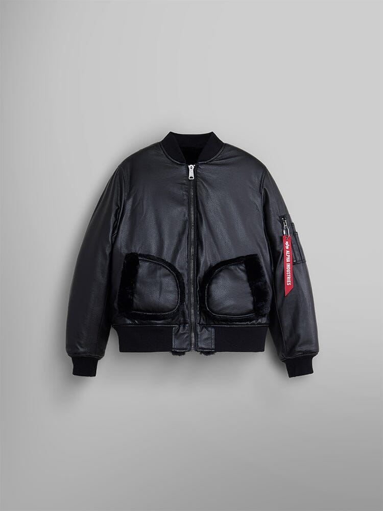 The Women's Reversible Faux Leather MA-1 Bomber Jacket in Black features a front zipper, two large pockets, and a distinctive red tag on the left sleeve.