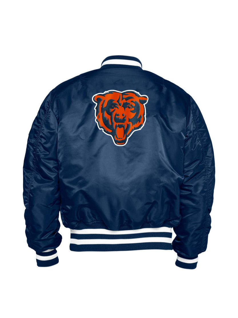 Introducing the Chicago Bears X Alpha X New Era MA-1 Bomber Jacket by Alpha Industries, a navy blue creation featuring a prominent orange and blue bear logo on the back. This jacket perfectly captures the essence of an NFL Bomber Jacket, making it an ideal choice for Chicago Bears fans eager to showcase their team spirit in style.