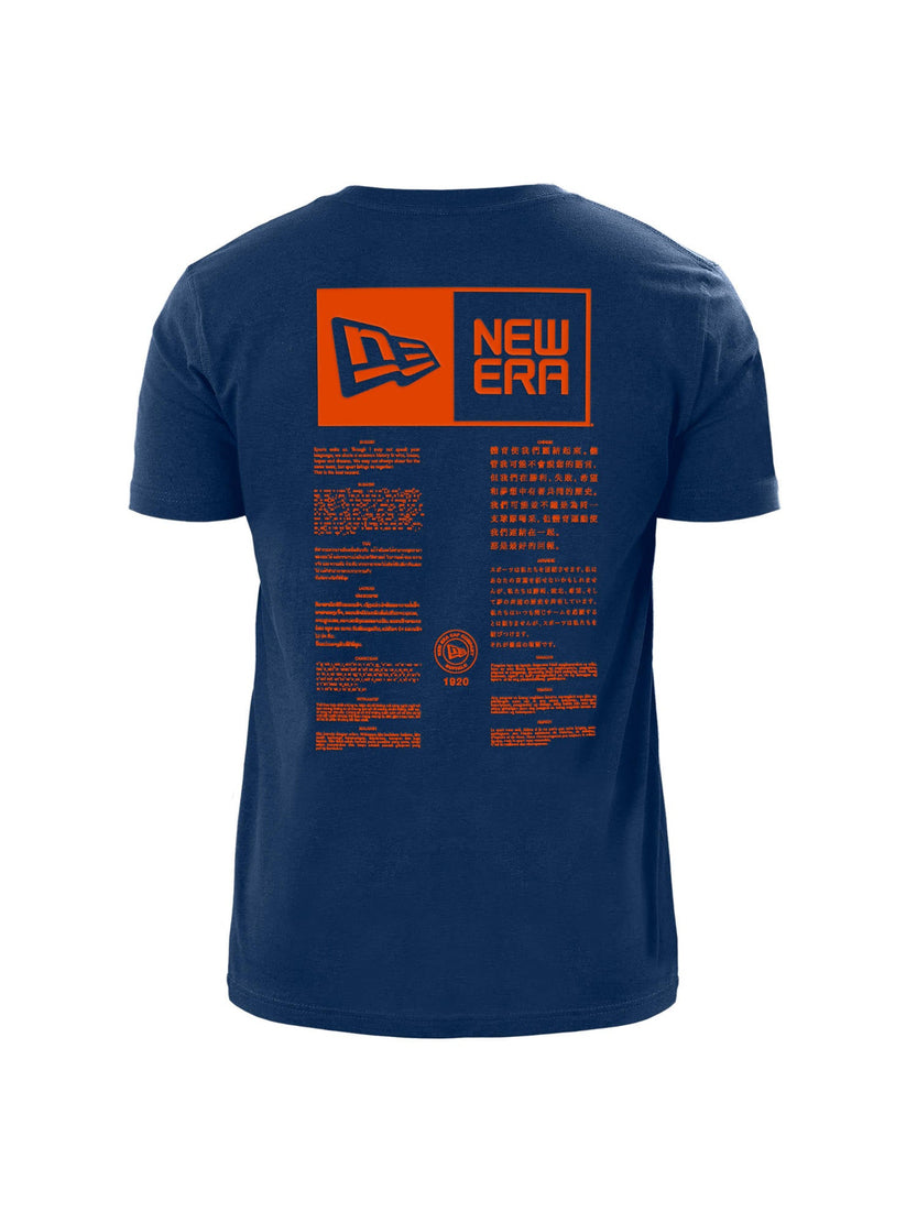 The back view of the Chicago Bears x Alpha x New Era T-Shirt, from Alpha Industries, showcases a distinctive navy blue color with an orange rectangle featuring the text "New Era" along with various other graphics and text reminiscent of team logo designs.