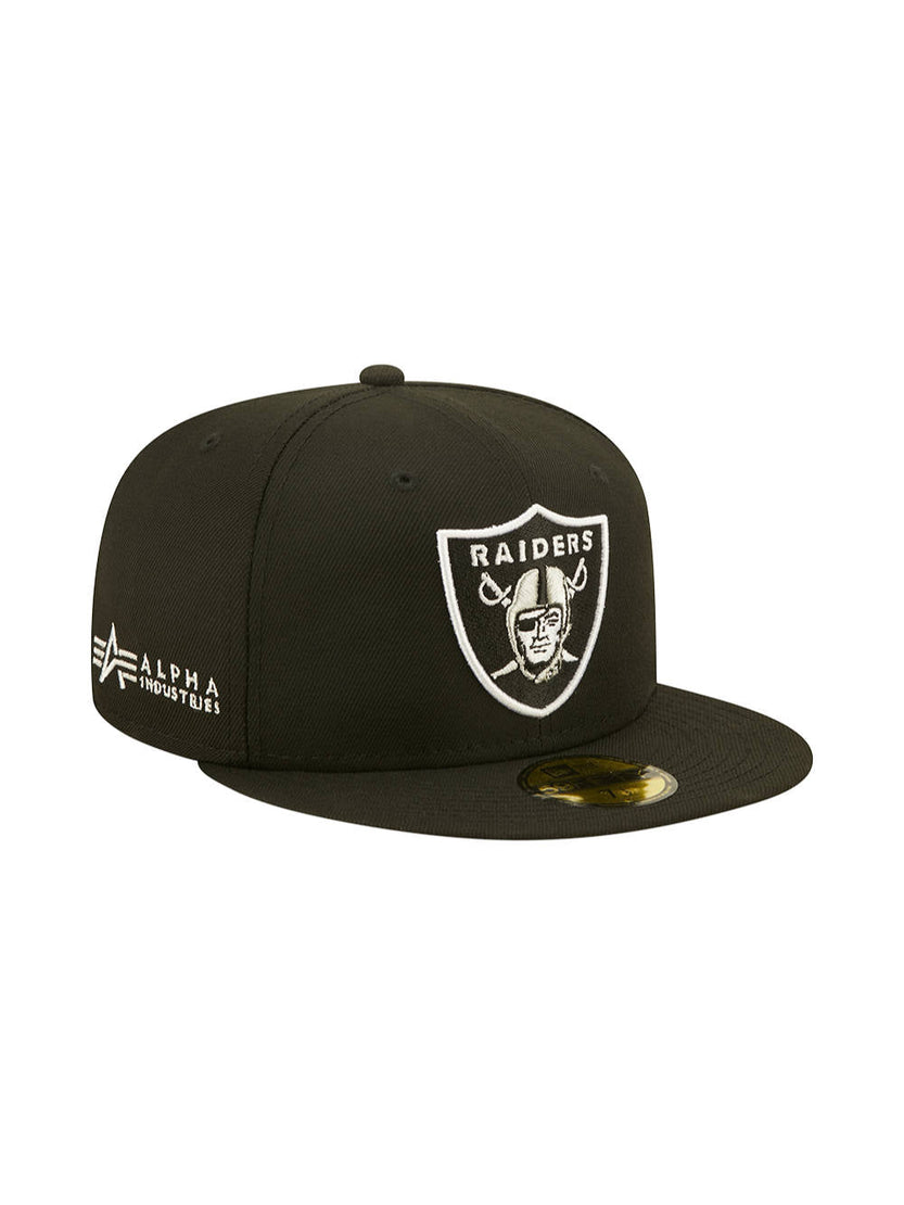 The Las Vegas Raiders x Alpha x New Era 59FIFTY Fitted Cap features a flat brim, with the embroidered team logo on the front and Alpha Industries branding on the side, all styled in the iconic team colors.