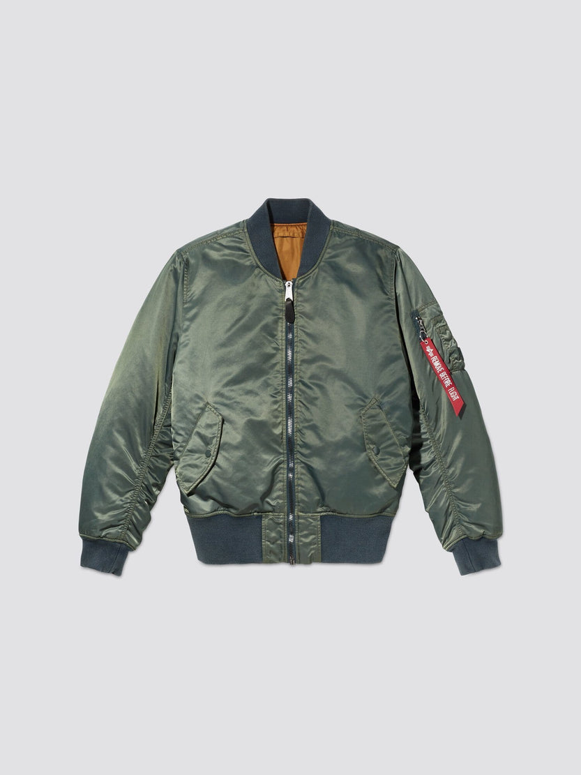 Teal MA-1 Battlewash Bomber Jacket from Alpha Industries, Inc., featuring a zip closure, ribbed cuffs, and two front pockets. A red tag is attached to the left sleeve, enhancing the classic design of this piece.