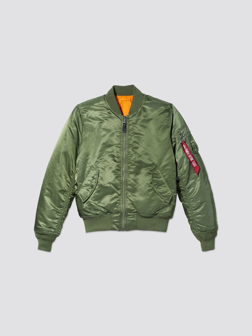 The MA-1 Bomber Jacket Slim Fit from Alpha Industries, Inc. is a slim fit sage jacket featuring a front zipper, orange lining, and a Remove Before Flight tag on the sleeve. Inspired by the classic MA-1 design, it offers a modern twist with its streamlined silhouette.