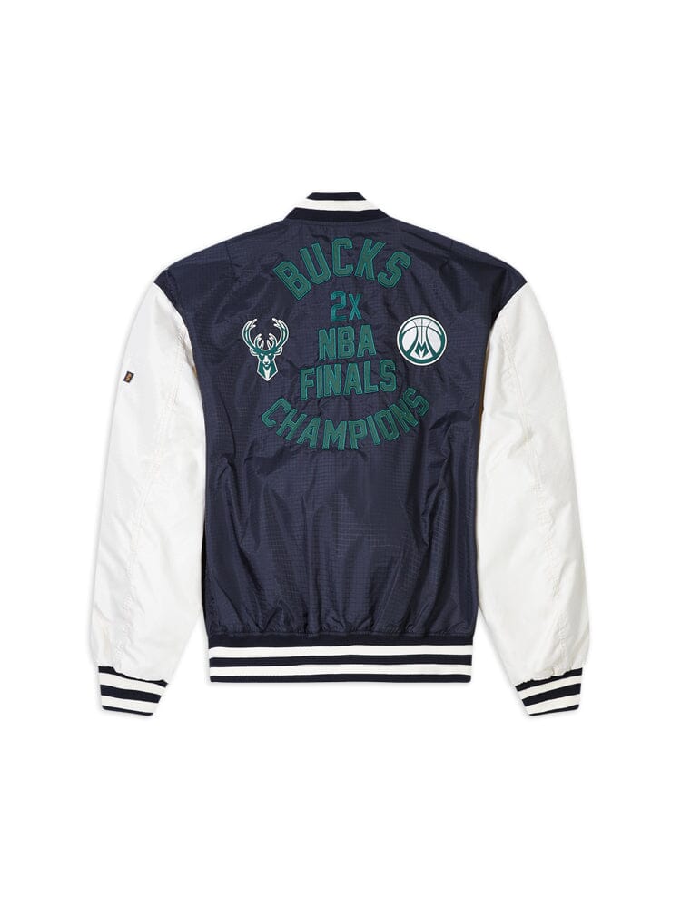 A Milwaukee Bucks x Alpha Industries x New Era L-2B Bomber Jacket in black and white, showcasing Bucks 2x NBA Finals Champions and logo designs on the back, enhanced with fashionable team patches.