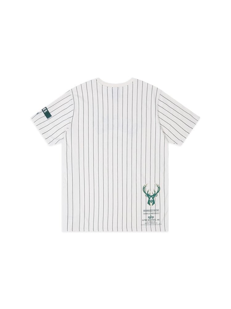 The Milwaukee Bucks x Alpha x New Era Tee by Alpha Industries showcases a white pinstriped design with a green deer logo and text on the lower back, seamlessly blending sporty elegance with subtle NBA-inspired flair.