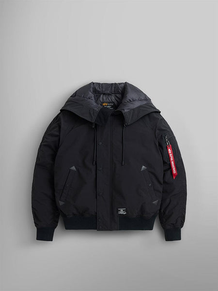 An N-2B Altitude Parka by Alpha Industries in black, showcasing its water-resistant fabric, detachable adjustable split hood, and a distinctive red tag on the sleeve.