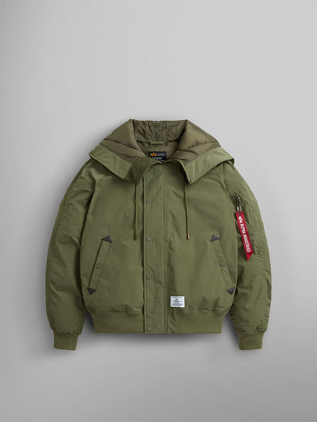 An N-2B Altitude Parka by Alpha Industries in green, showcasing its water-resistant fabric, detachable adjustable split hood, and a distinctive red tag on the sleeve.