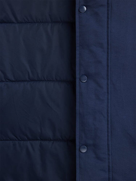 Close-up of the N-3B Altitude Mod Parka by Alpha Industries, featuring a dark blue quilted design with a visible buttoned flap.