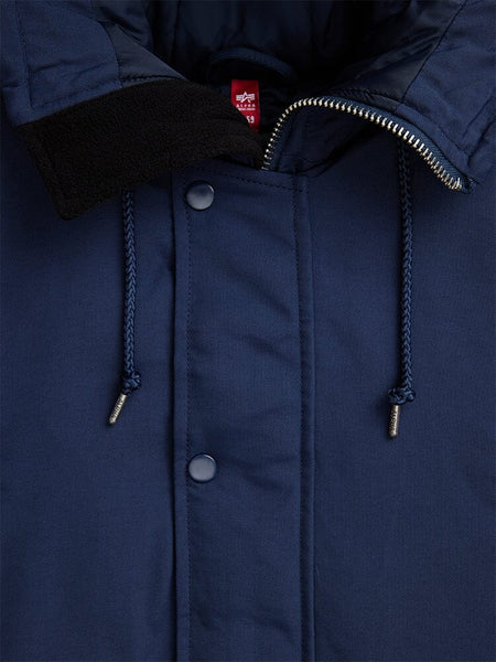 Close-up of the N-3B Altitude Mod Parka in navy blue by Alpha Industries, showcasing its visible zipper, buttons, and hood drawstrings.