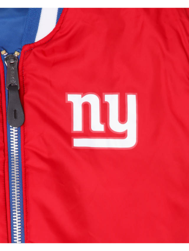 A close-up of the New York Giants x Alpha x New Era Reversible MA-1 Bomber Jacket by Alpha Industries showcases a striking red design with a blue zipper and a prominent white NY logo on the chest, embodying the essence of the New York Giants.