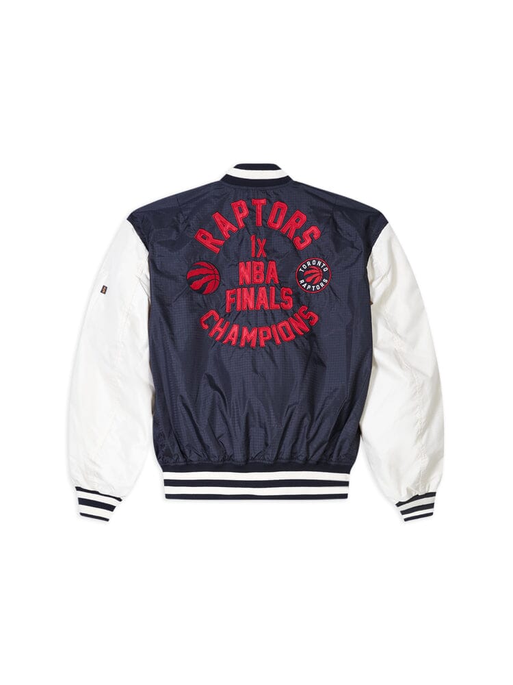 Presenting the Toronto Raptors X Alpha Industries X New Era L-2B Bomber Jacket, showcasing a navy and white design. The back features "Raptors IX NBA Finals Champions" in bold red lettering, accompanied by a small circular logo on the right side. Inside, you'll find a sophisticated pinstripe interior that enhances this commemorative piece's elegance.